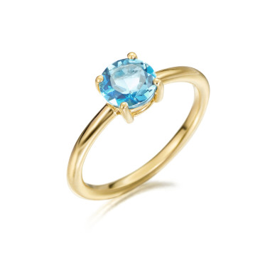 anillo en oro amarillo con piedra topacio azul